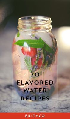 a mason jar filled with water and strawberries