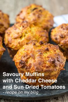 several muffins on a plate with the words savory muffins with cheddar cheese and sun dried tomatoes