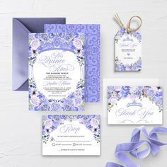 purple and white wedding stationery set with ribbon, tags, and matching envelopes