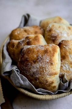 several pastries in a basket on a table