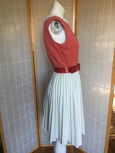 "Adorable late 1960's red and white polka dot dress - solid white pleated skirt. Red vinyl belt. Zips up the back women's small Bust just under 38\" Waist 36\" Hips free Shoulder to waist 16\" Waist to hem 22\" Belt 33\"" White Fitted Dress With Belt, Dress With Pleated Skirt, White Pleated Skirt, Red Vinyl, Grey Pencil Skirt, White Polka Dot Dress, Red Belt, Back Women, Lace Collar