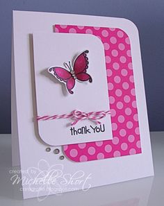 a pink and white card with a butterfly on it