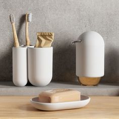 Minimalist shapes, matte finishes and soft-touch molded designs make these bath accessories look so clean and modern on countertops. Teen Bathrooms, Minimalist Shapes, Bathroom Toothbrush Holder, Email Branding, Bath Girls, Mark And Graham, Soap Pump, Mould Design, Curve Design