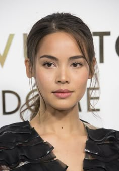 a close up of a person wearing a black dress