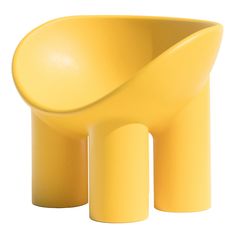 a yellow chair sitting on top of a white floor