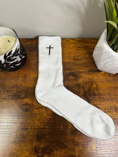 Cross embroidered Crew pair of Socks. Black Cross with White sock. One pair of socks with one cross on each sock. Left on one and right on other. Size: Men 6-12 Women 5-9 Family made faith apparel to get the conversation started!  check out more of our listings: https://praiseourgodapparel.etsy.com Custom Thread: Optional to Personalized  with your own color, options in photos.  Crew socks are made to order. Please ask any questions before purchase. Please allow for slight color variation in pro Christian Socks, Embroidery Socks, Faith Apparel, Cross Embroidery, Faith Clothing, Personalized Socks, How To Start Conversations, Black Cross, Long Sleeve Tee Shirts