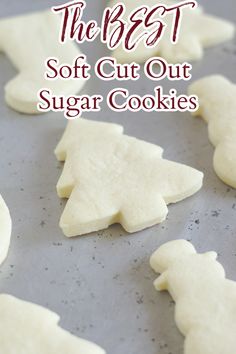 the best soft cut out sugar cookies on a baking sheet with text overlay that reads, the best soft cut out sugar cookies