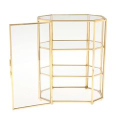 three glass shelves with gold trimmings on each side and one shelf in the middle