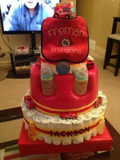 a cake made to look like a fireman's birthday cake with bottles on top