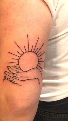 a woman's arm with a tattoo on it that reads, you are the sun