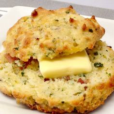 two biscuits with cheese are on a plate