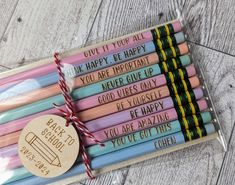 six pencils in a box with the words give it you're happy, you are important and never give up