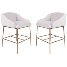 pair of white upholstered bar stools with gold metal frame legs and arms