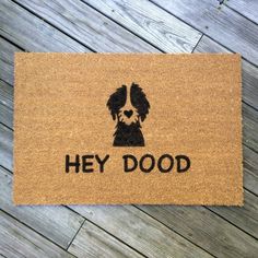 a door mat that says hey dood with a dog's face on it