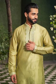 Sap green kurta with embroidered placket and cuffs. Paired with a churidar and mughal printed bundi. - Aza Fashions Green Long Sleeve Traditional Wear With Embroidered Border, Ceremonial Green Kurta For Navratri, Green Ceremonial Kurta For Navratri, Green Long Sleeve Kurta With Embroidered Border, Festive Green Sherwani With Embroidered Border, Green Long Sleeve Bollywood Bandhgala, Ceremonial Green Kurta With Chikankari Embroidery, Ceremonial Green Chikankari Embroidered Kurta, Ceremonial Green Chikankari Embroidery Kurta