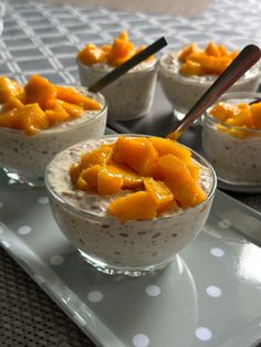 small bowls filled with oatmeal topped with fruit