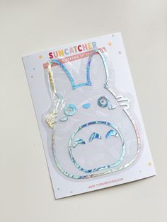 a sticker with an image of a bunny face on it's side and the words, suncather