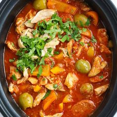 a close up of a bowl of food with meat and vegetables