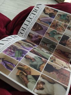 an open book with pictures of women in different outfits on it's cover, sitting on a red blanket