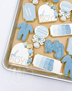 baby shower cookies in a box on a table