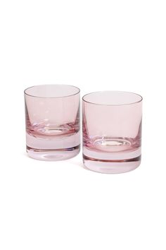 two pink glasses sitting next to each other