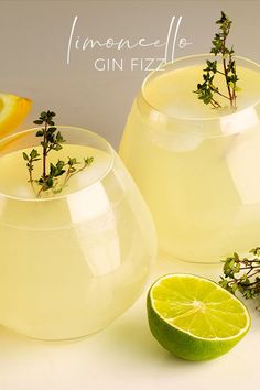 lemonade gin fizz is garnished with fresh herbs and served in glass pitchers