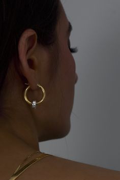 The classic gold hoop reinvented. Crafted in high polish 18K Gold vermeil with sterling silver accent, the Greyson hoops are a staple in the Hydez Essential Collection. These sophisticated head-turners will luxe up any look. Our two tone design means you’ll never have to choose between gold and silver.Materials: 18K Gold Vermeil and Sterling SilverDimensions: 20mm hoop, 3mm width What is 18K Gold Vermeil?: 3 microns of 18K Gold over Sterling Silver. Vermeil is far more durable to wear than tradi Gold Hammered Huggie Earrings, Gold Hammered Huggie Earrings In 14k, Gold Hammered 14k Gold Huggie Earrings, Yellow Gold Hallmarked Hoop Earrings For Everyday, Silver Polished Gold-plated Hoop Earrings, Gold Hoop Earrings With Vvs Clarity For Formal Occasions, Timeless Hallmarked Round Hoop Earrings, Gold Sterling Silver Hoop Earrings, Yellow Gold Sterling Silver Hoop Earrings For Everyday