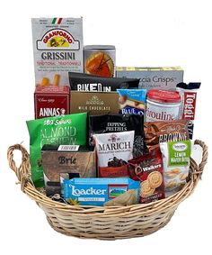 a wicker basket filled with lots of different types of food and snacks in it