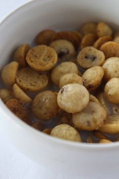 homemade cookie crisp cereal in a white bowl with text overlay that reads, homemade cookie crisp cereal super fun and totally delicious