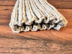 a close up of a mop on a wooden floor