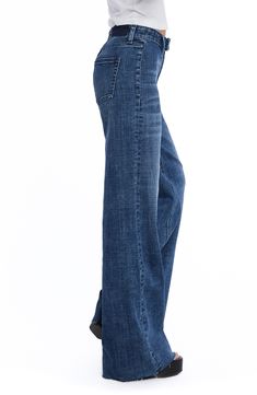 Tailored with an easy-fitting wide leg, these stretch-denim jeans feature a flat front and two back patch pockets. 32" inseam; 23" leg opening; 10 1/4" front rise Zip fly with button closure Back patch pockets 69% cotton, 27% REPREVE® recycled polyester, 3% rayon, 1% spandex REPREVE recycled polyester is made from 100% post-consumer recycled plastic bottles Machine wash, tumble dry Imported Denim Blue Full Length Flare Jeans With Five Pockets, Denim Blue Relaxed Fit Flare Jeans, Relaxed Fit Denim Blue Flare Jeans, Full Length Denim Flare Jeans, Wide Leg Dark Wash Flare Jeans, Denim Blue Wide Leg Pants, Back Patch, Recycle Plastic Bottles, Marbella