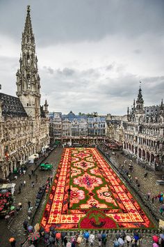 an aerial view of a large carpeted area in the middle of a city square