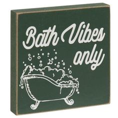 a sign that says bath vibes only on the side of a green and white box