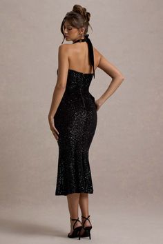 Party season calls for a statement piece like Adee. Expertly crafted in a shimmering sequinned velvet, this black midi dress is further enhanced by a self-tie halter neckline, large oversized bow and flattering flared hemline. Keep Adee at the forefront of your next soiree and style yours with a simple sleek bun and strappy stilettos.  Features  - Premium sequin velvet - Halter neckline  - Self-tie straps - Invisible zip closure  - Oversized bow detail - Flared hemline - Midi length   Sizing &am Concert Dresses, Red Dress Long, Sleek Bun, Club L London, Cocktail Dress Formal, Strappy Stilettos, Corsets And Bustiers, Strapless Tops, Black Midi