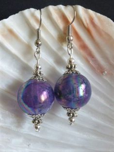 These are beautiful shimmering purple AB glass bubble earrings, made with large 14mm beads. They hang from nickel free silver plated brass ear wires. The earrings measure approximately 50mm in length (including the ear wires). They will be sent to you in a pretty organza gift bag, by second class post/Airmail (excluding weekends). Iridescent Christmas, Bubble Earrings, Christmas Bauble, Lovely Earrings, Organza Gift Bags, Christmas Baubles, Jewelry Gift, Gift Bag, Jewelry Earrings Dangle