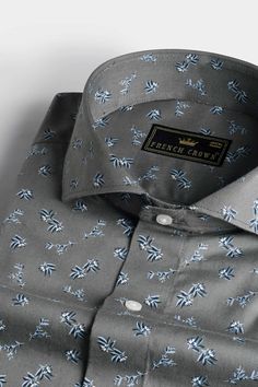 Infuse your wardrobe with nature-inspired elegance through the Gunsmoke Gray Leaves Printed Twill Premium Cotton Shirt. The delicate leaves print on the gunsmoke gray background adds a touch of sophistication and individuality to your ensemble. Crafted from premium cotton, this shirt features a trendy cut away collar and ensures both comfort and style. Whether you're attending a casual gathering or seeking to make a statement, embrace a sense of effortless chic with this versatile and eye-catchi Leaves Print, Cotton Shirts For Men, Formal Casual, Effortless Chic, Gray Background, Collar And Cuff, Leaf Prints, Nature Inspired, Cotton Shirt