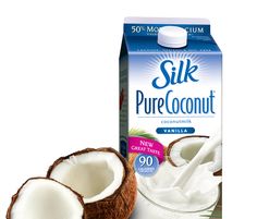 a carton of silk pure coconut milk next to it's cut in half