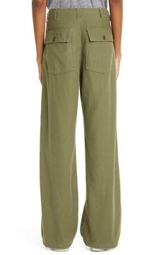 These utility pants are cut in a wide-leg silhouette from Japanese surplus military sateen that's slubbed and treated with an enzyme wash for softness. 32" inseam; 22" leg opening; 13" front rise; 15 1/2" back rise (size 28) Zip fly with button closure Front slant pockets; back button-flap patch pockets 100% cotton Machine wash, tumble dry Imported SPACE: A shop for emerging and advanced designers Olive Straight Leg Cargo Pants, Wide Leg Washed Bottoms For Work, Wide Leg Workwear Bottoms, Utility Washed Pants For Workwear, Khaki Wide Leg Relaxed Fit Jeans, Relaxed Fit Washed Pants For Work, Solid Color Wide Leg Cargo Jeans, Utility Style Wide Leg Washed Bottoms, Utility Straight Leg Washed Pants