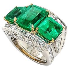 A remarkable green of emerald is the summit of this platinum ring adorned with diamonds. Three emeralds are displayed in emerald cuts, emphasizing brilliant hues and depth. 18k yellow gold prongs secure the gemstones. Platinum is the wide band, featuring a channel setting of baguette diamonds across the top and five bezel-set brilliant cut diamonds on each side of the bridge. Side stones of five ascending diamonds provide additional shine. The total weight is 10.36 carats of emeralds and 3.26 ca Expensive Diamond, Trio Ring, Channel Setting, Baguette Diamonds, Fancy Jewelry, Emerald Jewelry, Platinum Ring, Emerald Gemstone, Three Stone Rings