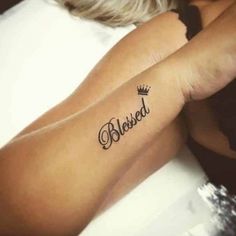 a woman's arm with a tattoo that says beloved on the left side of her arm