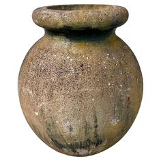 an old, dirty vase is shown against a white background