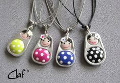 four charms with different designs on them