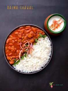 a bowl filled with rice and beans on top of a table