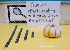 a sign that says guess which ribbon will wrap around the pumpkin? on a table