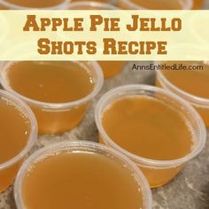 apple pie jello shots in plastic cups on a counter top with text overlay