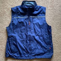 Great Condition Never Worn. Multiple Pockets. Vent In Back. Sleeveless Blue Outdoor Outerwear, Sleeveless Blue Outerwear For Outdoor, Navy Sleeveless Outerwear With Pockets, Sleeveless Blue Outerwear For Outdoor Activities, Blue Sporty Outdoor Vest, Blue Sporty Vest For Outdoor, Blue Sporty Sleeveless Outerwear, Sporty Sleeveless Blue Outerwear, Fishing Vest