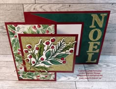 two cards with holly and berries on them, one is green and the other is red