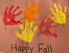 handprints on a piece of paper that says happy fall