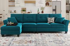 a living room with a blue couch and ottoman