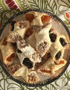 a close up of a plate of food with raisins and cookies on it